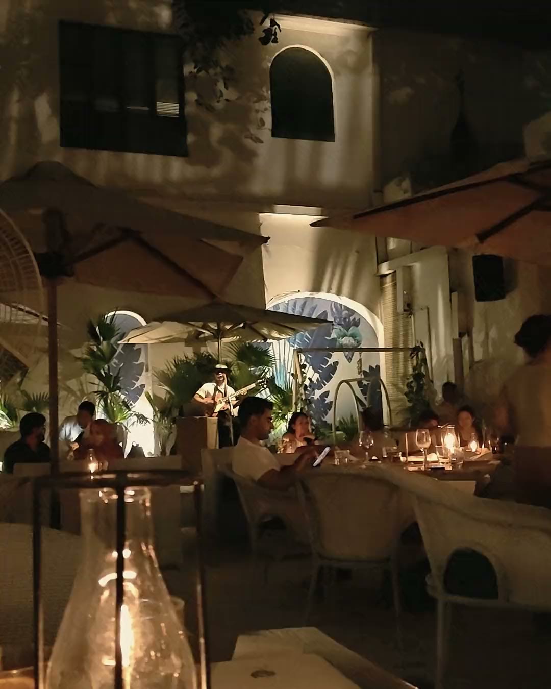 Candlelit tables in the courtyard at Olive